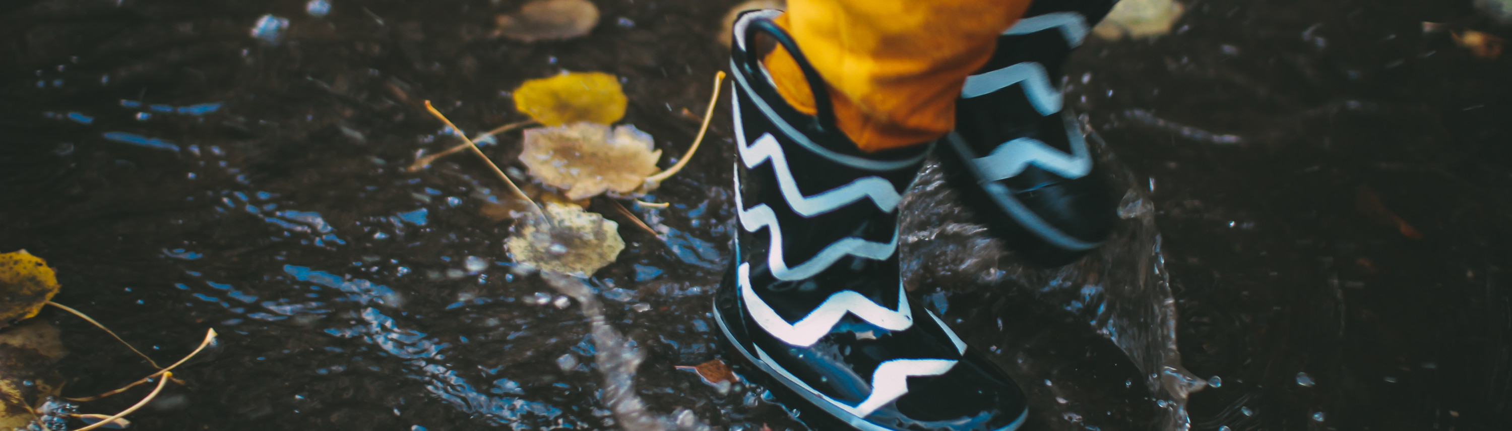 Child in rain puddle